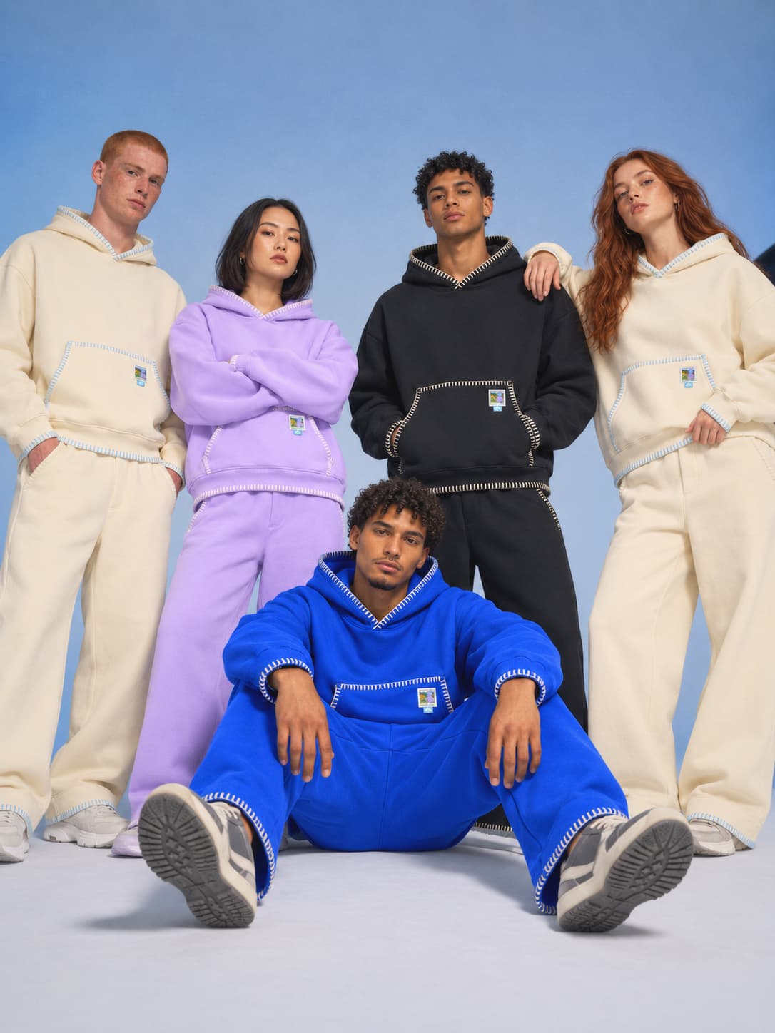 Five friends posing together in the Coziya Set in Beige, Purple, Black and Majorelle Blue
