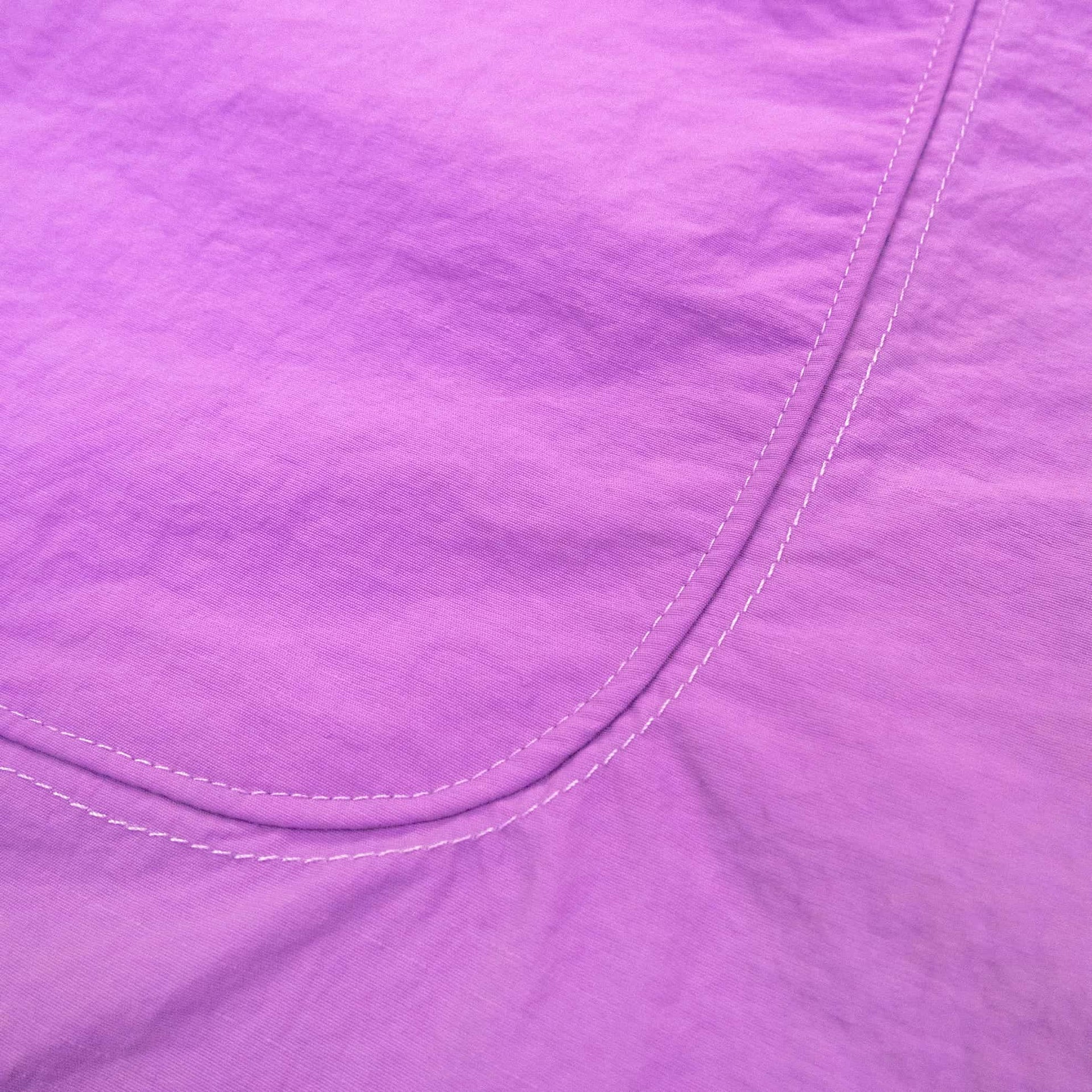 Coziya purple swim trunks pocket stitching detail close-up