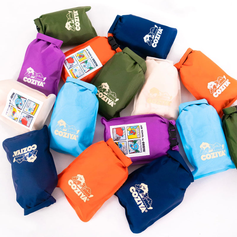 Coziya Air Towel all 6 colors in waterproof pouches lineup flat lay