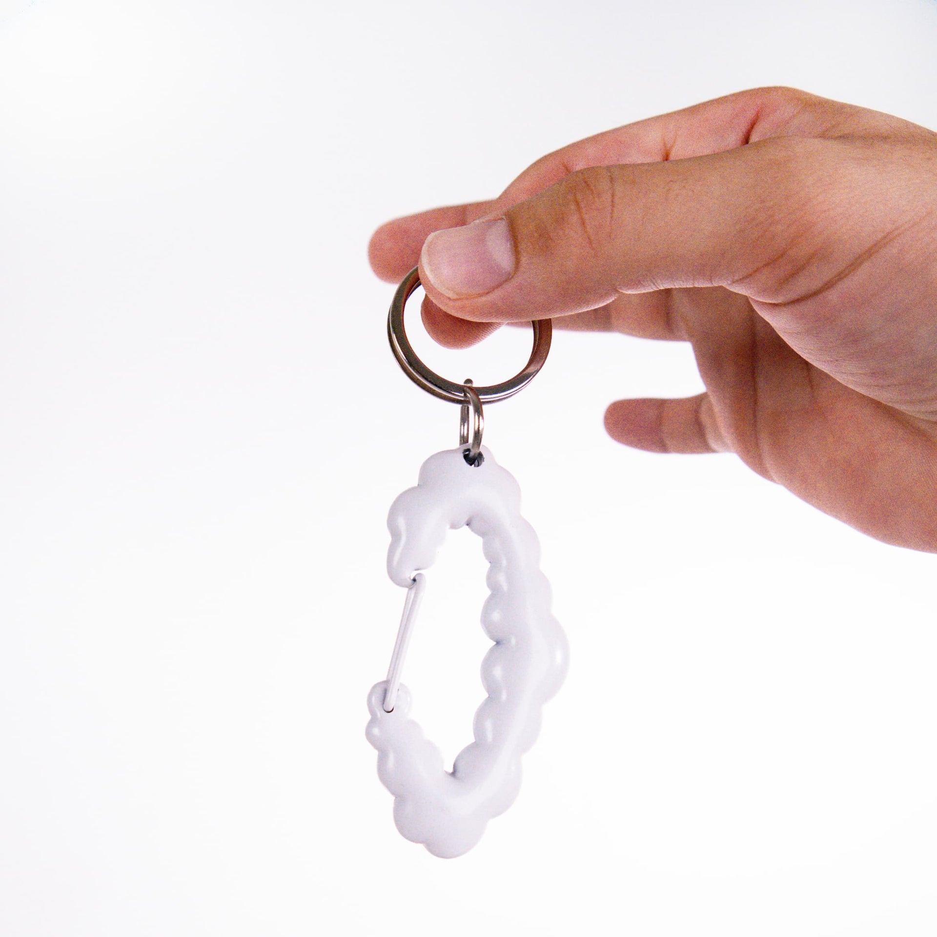 Coziya cloud carabiner keychain lifestyle shot clipped to bag