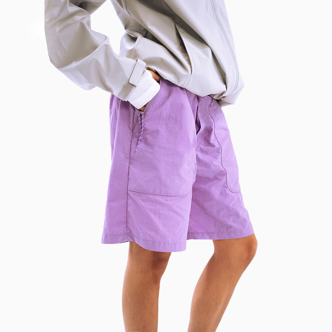 Coziya purple swim trunks worn by woman pocket detail outdoor