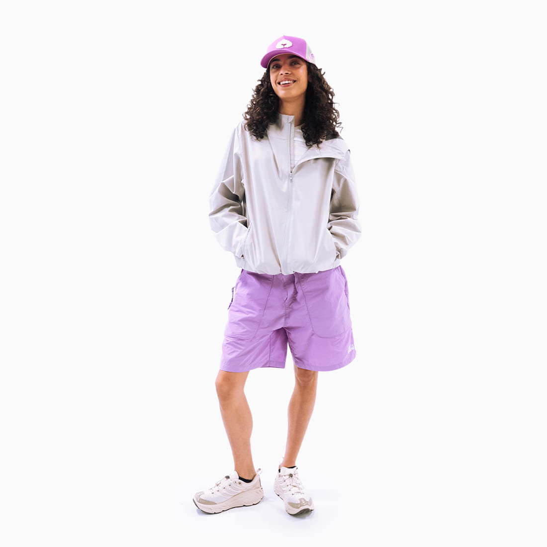 Coziya purple swim trunks worn by woman outdoor beach lifestyle