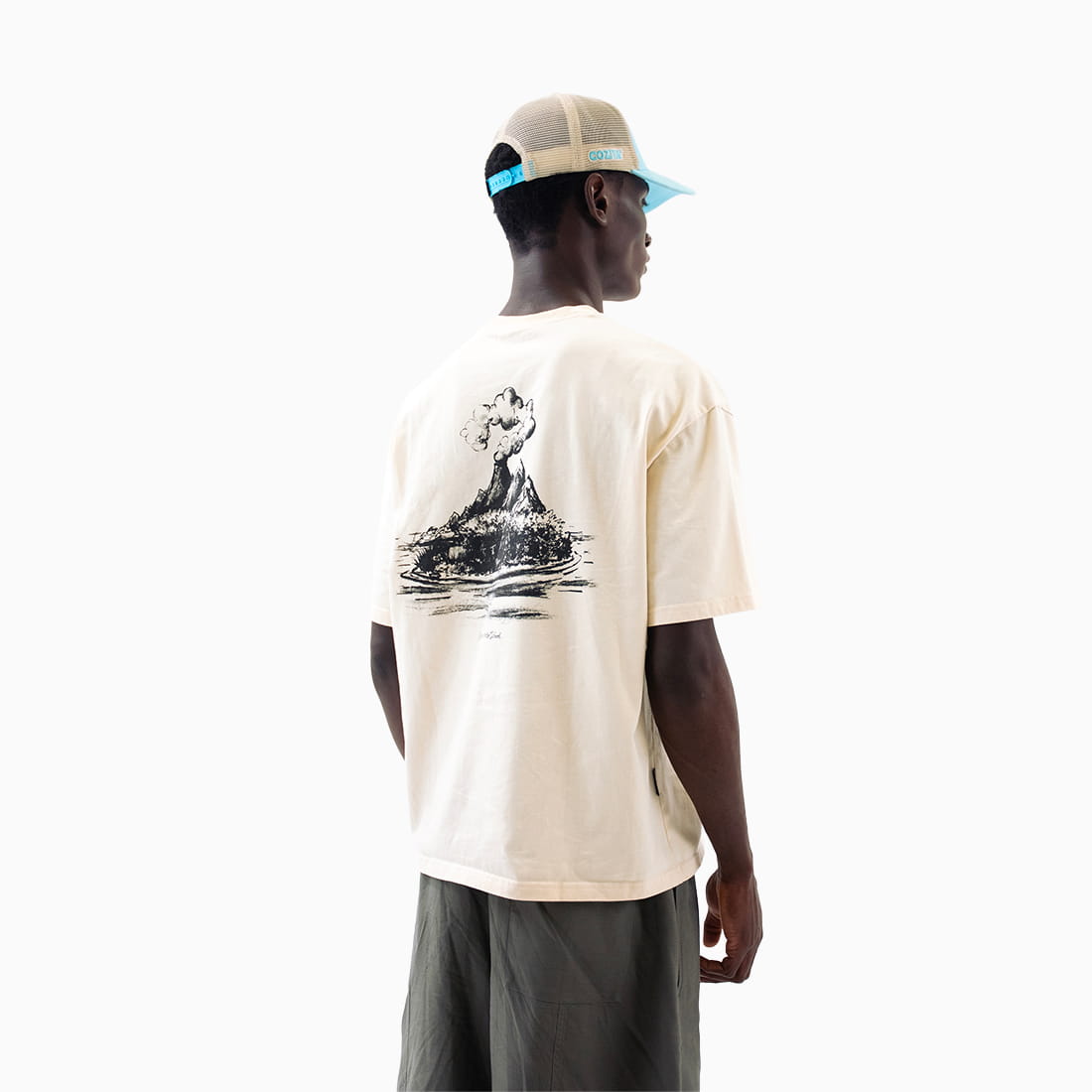 Coziya Mystery Island cream graphic tee worn by man relaxed fit lifestyle